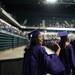 A graduate waves as she marches out into EMU's Convocation Center during the start of Pioneer's 2013 graduation ceremony, Thursday, June 6.
Courtney Sacco I AnnArbor.com 